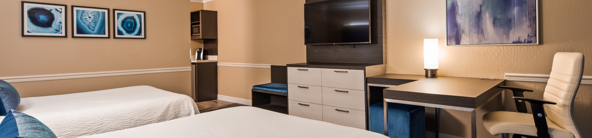 Hotel bedroom with two beds and TV