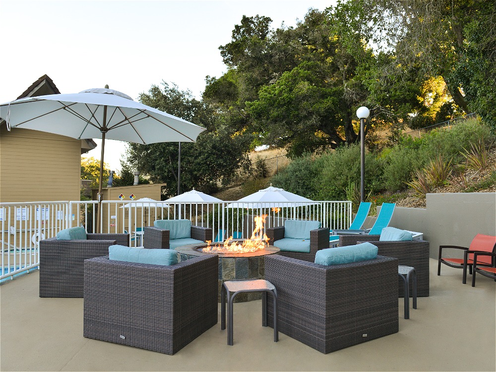 Outdoor seating with fire pit and umbreallas