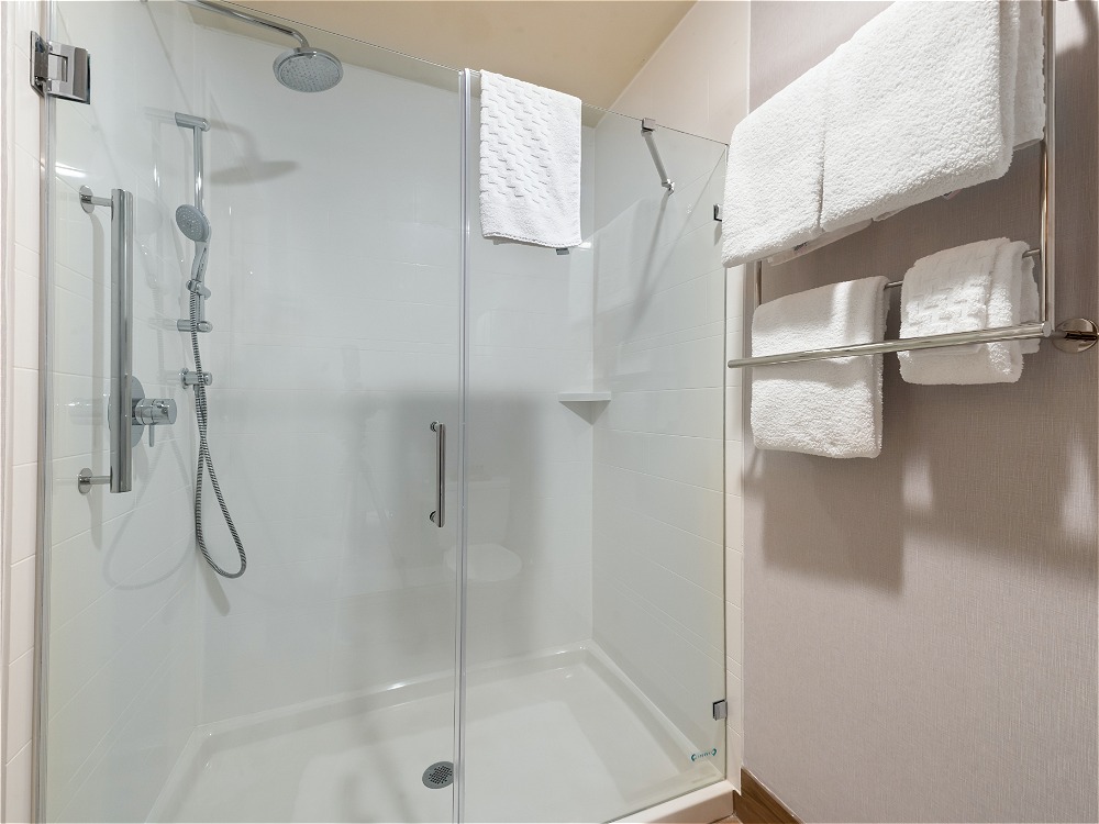 Hotel bathroom with shower and towels