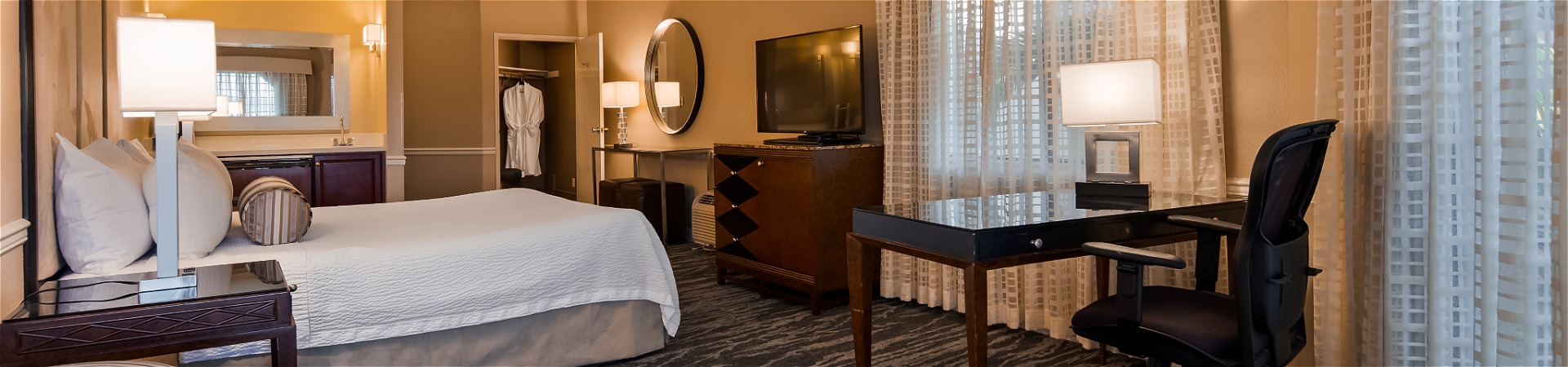 Hotel bedroom with one bed and TV